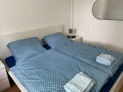 Ein Bett oder Betten in einem Zimmer der Unterkunft Pempelforter Domizil