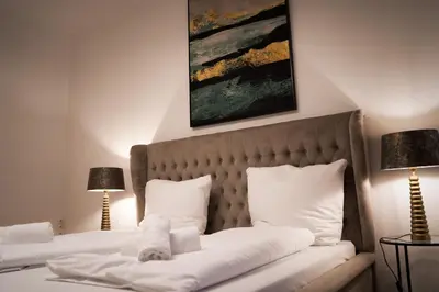 Ein Bett oder Betten in einem Zimmer der Unterkunft Junik Apartments - Ferienwohnungen in Duisburg