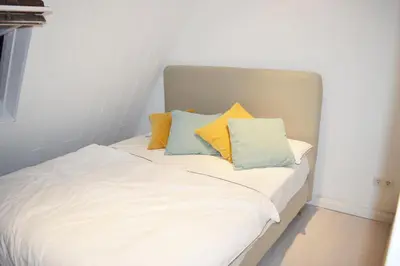 Ein Bett oder Betten in einem Zimmer der Unterkunft Rüttenscheid Dachgeschoßwohnung