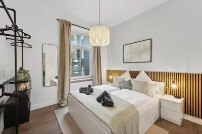Ein Bett oder Betten in einem Zimmer der Unterkunft Zentral Wohnen im Luisenviertel Küche & Smart-TV