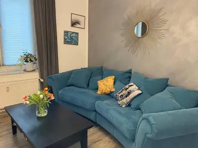 Ein Sitzbereich in der Unterkunft Cozy Apartment