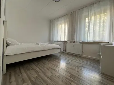 Ein Bett oder Betten in einem Zimmer der Unterkunft My Pension Duisburg