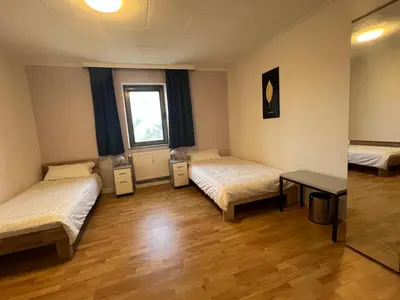 Ein Bett oder Betten in einem Zimmer der Unterkunft My Pension Duisburg