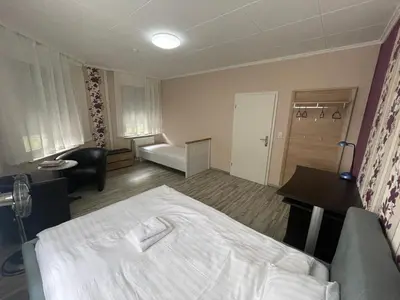 Ein Bett oder Betten in einem Zimmer der Unterkunft My Pension Duisburg