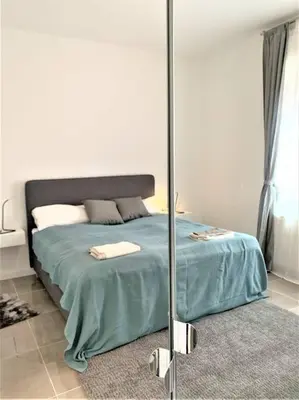 Ein Bett oder Betten in einem Zimmer der Unterkunft Stilvoll eingerichtete Wohnung in Essen-Südviertel