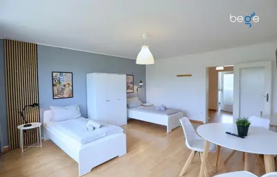 Ein Bett oder Betten in einem Zimmer der Unterkunft BEGE APARTMENTS Executive Lodgings