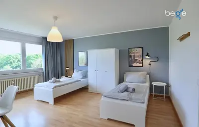 Ein Bett oder Betten in einem Zimmer der Unterkunft BEGE APARTMENTS Executive Lodgings