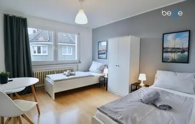 Ein Bett oder Betten in einem Zimmer der Unterkunft BEGE APARTMENTS Executive Lodgings