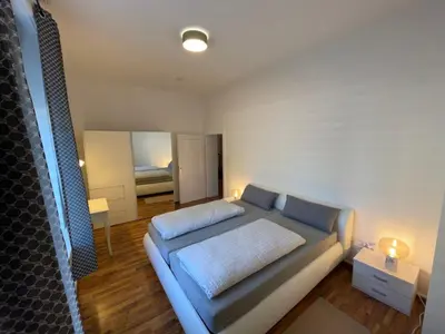 Ein Bett oder Betten in einem Zimmer der Unterkunft OnThePoint, Erdgeschoss, Abstellplatz für Fahrräder, City und Innenhafen 5 Gehminuten!!!