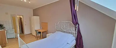 Ein Bett oder Betten in einem Zimmer der Unterkunft Le Relais - Appart'Hotel