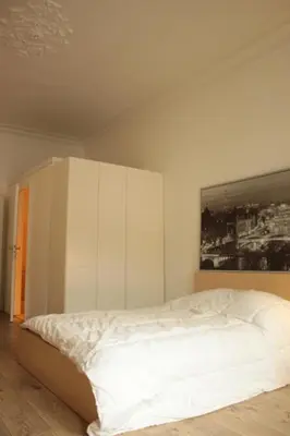Ein Bett oder Betten in einem Zimmer der Unterkunft Le Relais - Appart'Hotel
