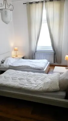 Ein Bett oder Betten in einem Zimmer der Unterkunft Le Relais - Appart'Hotel