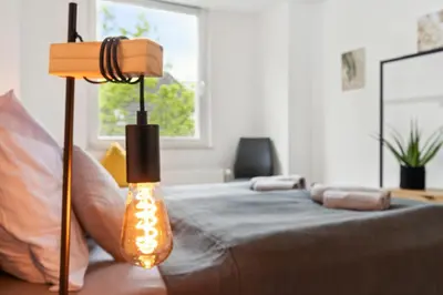 Ein Bett oder Betten in einem Zimmer der Unterkunft Stylisches Apartment, 2-5 Personen, Zentral, Nähe Messe