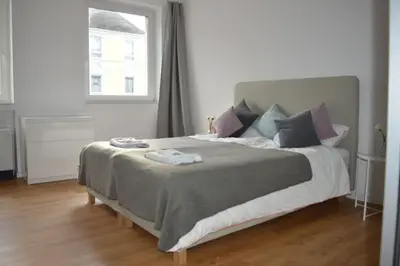 Ein Bett oder Betten in einem Zimmer der Unterkunft Rüttenscheid, Messe, Uni, Central Station