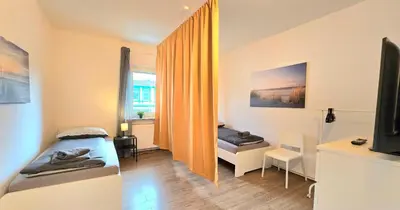 Ein Bett oder Betten in einem Zimmer der Unterkunft Modern 4-Room Apartment with Balcony & Free Parking & Free Wi-Fi - KA02
