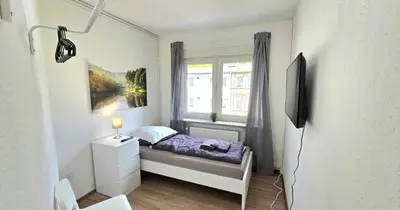 Ein Bett oder Betten in einem Zimmer der Unterkunft Modern 4-Room Apartment with Balcony & Free Parking & Free Wi-Fi - KA02