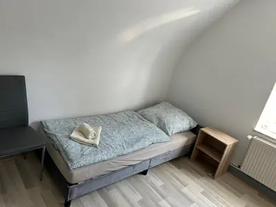 Ein Bett oder Betten in einem Zimmer der Unterkunft Monteurwohnung Haus Elbert 4