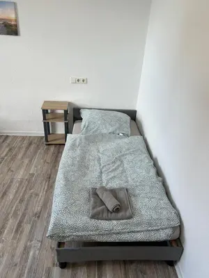 Ein Bett oder Betten in einem Zimmer der Unterkunft Monteurwohnung Haus Elbert 4