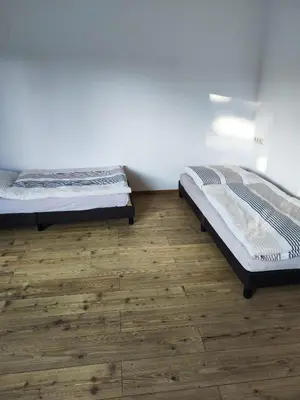 Ein Bett oder Betten in einem Zimmer der Unterkunft Monteurwohnung Haus Elbert 4