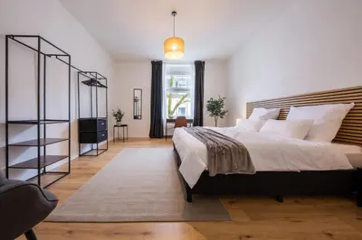 Ein Bett oder Betten in einem Zimmer der Unterkunft stayVision FS43 Wohnung 5 - 3 Schlafzimmer - 8 Gäste - 2 Balkone - top WLAN