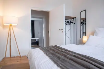 Ein Bett oder Betten in einem Zimmer der Unterkunft stayVision FS43 Wohnung 5 - 3 Schlafzimmer - 8 Gäste - 2 Balkone - top WLAN