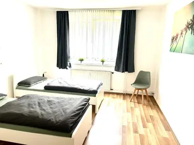 Ein Bett oder Betten in einem Zimmer der Unterkunft Kulturmensch Oberhausen mit Balkon