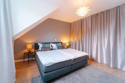 Ein Bett oder Betten in einem Zimmer der Unterkunft Zentral gelegene Ferienwohnung Solingen - Ohligs