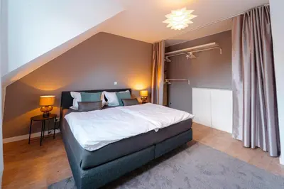 Ein Bett oder Betten in einem Zimmer der Unterkunft Zentral gelegene Ferienwohnung Solingen - Ohligs