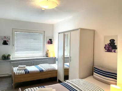 Ein Bett oder Betten in einem Zimmer der Unterkunft Helle, großzügige Wohnung für bis zu 6 Personen