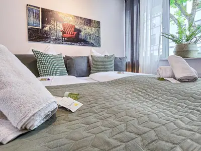 Ein Bett oder Betten in einem Zimmer der Unterkunft Alpha Apartments