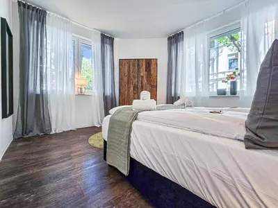 Ein Bett oder Betten in einem Zimmer der Unterkunft Alpha Apartments