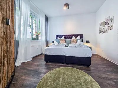 Ein Bett oder Betten in einem Zimmer der Unterkunft Alpha Apartments