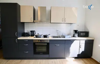 Küche/Küchenzeile in der Unterkunft BEGE APARTMENTS Coporate Haven
