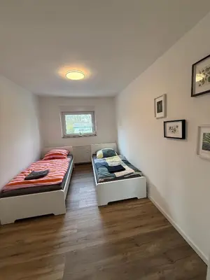 Ein Bett oder Betten in einem Zimmer der Unterkunft Schöne Apartments am Rot-Weiss Essen Stadion E01 bis E04