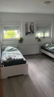 Ein Bett oder Betten in einem Zimmer der Unterkunft Schöne Apartments am Rot-Weiss Essen Stadion E01 bis E04