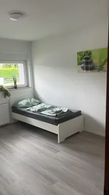 Ein Bett oder Betten in einem Zimmer der Unterkunft Schöne Apartments am Rot-Weiss Essen Stadion E01 bis E04