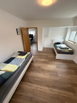Ein Bett oder Betten in einem Zimmer der Unterkunft Schöne Apartments am Rot-Weiss Essen Stadion E01 bis E04