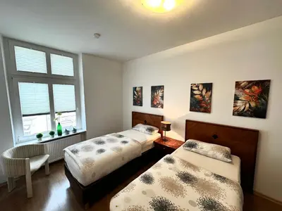 Ein Bett oder Betten in einem Zimmer der Unterkunft Neuwertige Komfortwohnung in schönem Altbau für max. 3 Personen