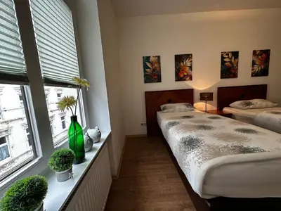 Ein Bett oder Betten in einem Zimmer der Unterkunft Neuwertige Komfortwohnung in schönem Altbau für max. 3 Personen