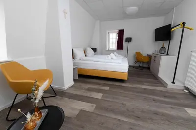Ein Bett oder Betten in einem Zimmer der Unterkunft St. Barbara-Haus
