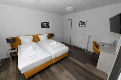 Ein Bett oder Betten in einem Zimmer der Unterkunft St. Barbara-Haus