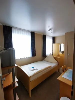 Ein Bett oder Betten in einem Zimmer der Unterkunft Hotel Art Balkanhof