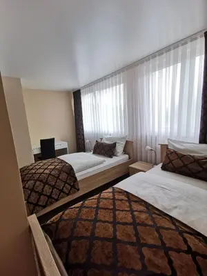 Ein Bett oder Betten in einem Zimmer der Unterkunft Hotel Art Balkanhof