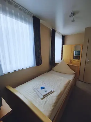 Ein Bett oder Betten in einem Zimmer der Unterkunft Hotel Art Balkanhof
