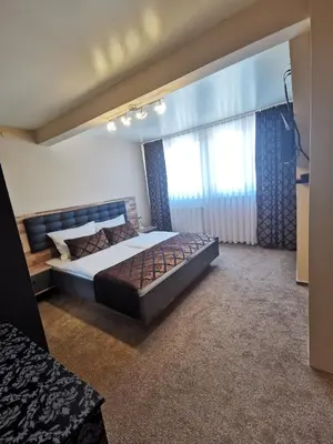 Ein Bett oder Betten in einem Zimmer der Unterkunft Hotel Art Balkanhof
