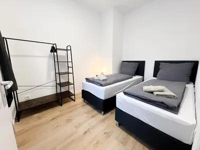 Ein Bett oder Betten in einem Zimmer der Unterkunft Vibehome Düsseldorf - Little Tokyo