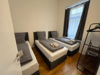 Ein Bett oder Betten in einem Zimmer der Unterkunft Vibehome Düsseldorf - Little Tokyo