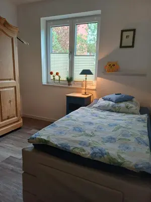 Ein Bett oder Betten in einem Zimmer der Unterkunft Fewo 
