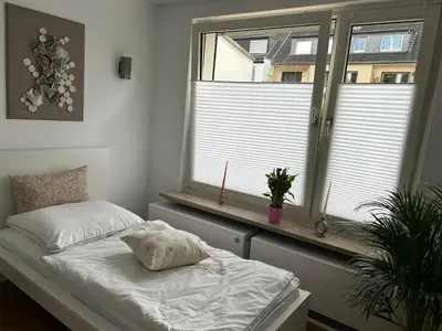 Ein Bett oder Betten in einem Zimmer der Unterkunft Casa Commodore Nähe Messe Düsseldorf