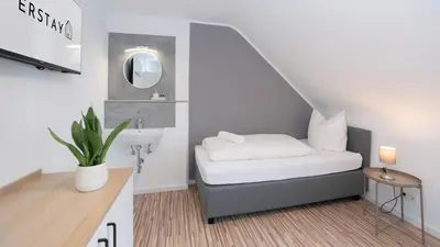 Ein Bett oder Betten in einem Zimmer der Unterkunft ERSTAY - moderne Zimmer